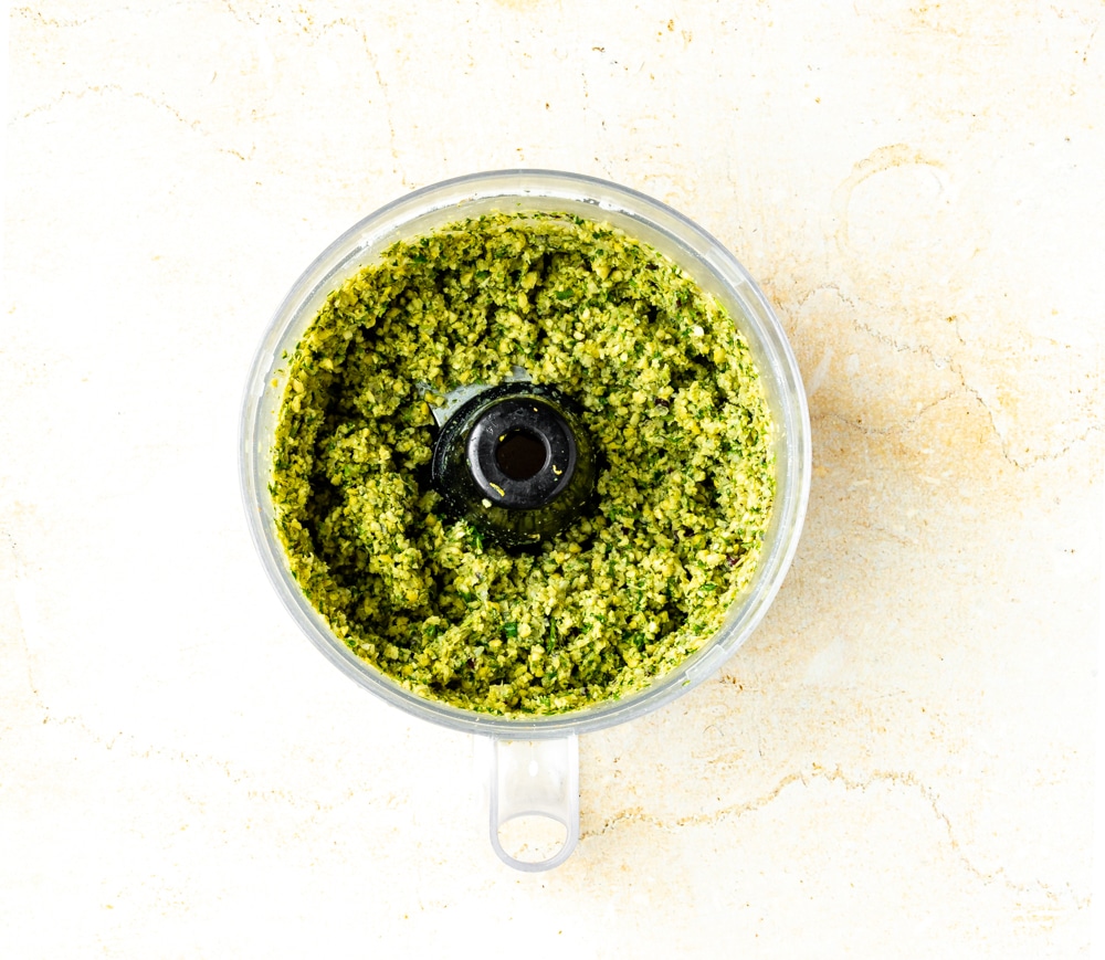 chickpeas parsley, cilantro, flour, cayenne, lemon zest, ground cardamom, ground cumin, onions, garlic, salt, pepper, baking soda, mixed in food processor